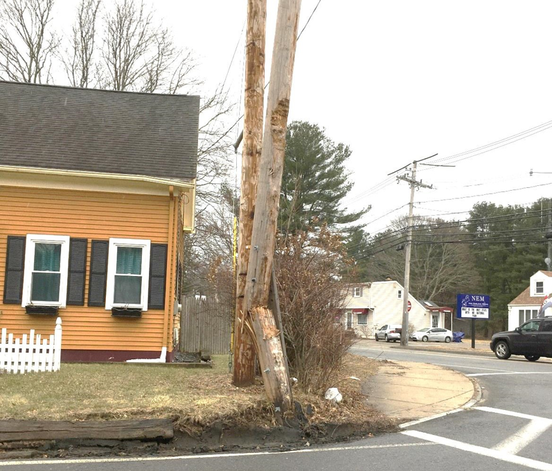 FIGURE 4. Telephone Pole in front of 3 Maple Street 
Figure 4 shows the telephone pole on the southeast corner of the intersection, which is frequently damaged by trucks making a right turn onto Maple Street from Route 126 northbound.
